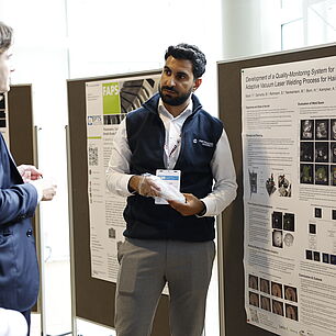 EPTS - Yazan Bajah showing participants his poster