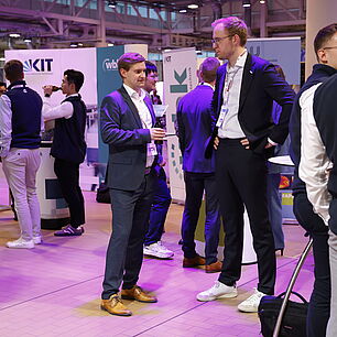 EPTS - Participants talking in the exhibtion at the evening event