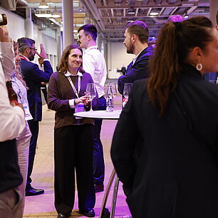 EPTS - Participants talking in the exhibtion at the evening event