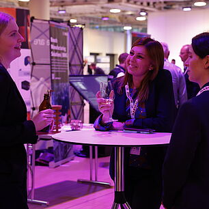 EPTS - Participants talking in the exhibtion at the evening event