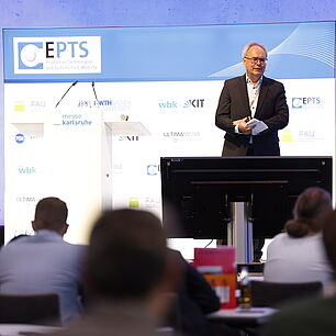 EPTS - Prof. Jürgen Fleischer on stage speaking to the crowd