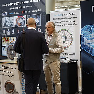 EPTS - Exhibitor Marposs talking with participant