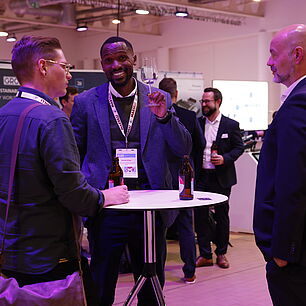 EPTS - Participants talking in the exhibtion at the evening event